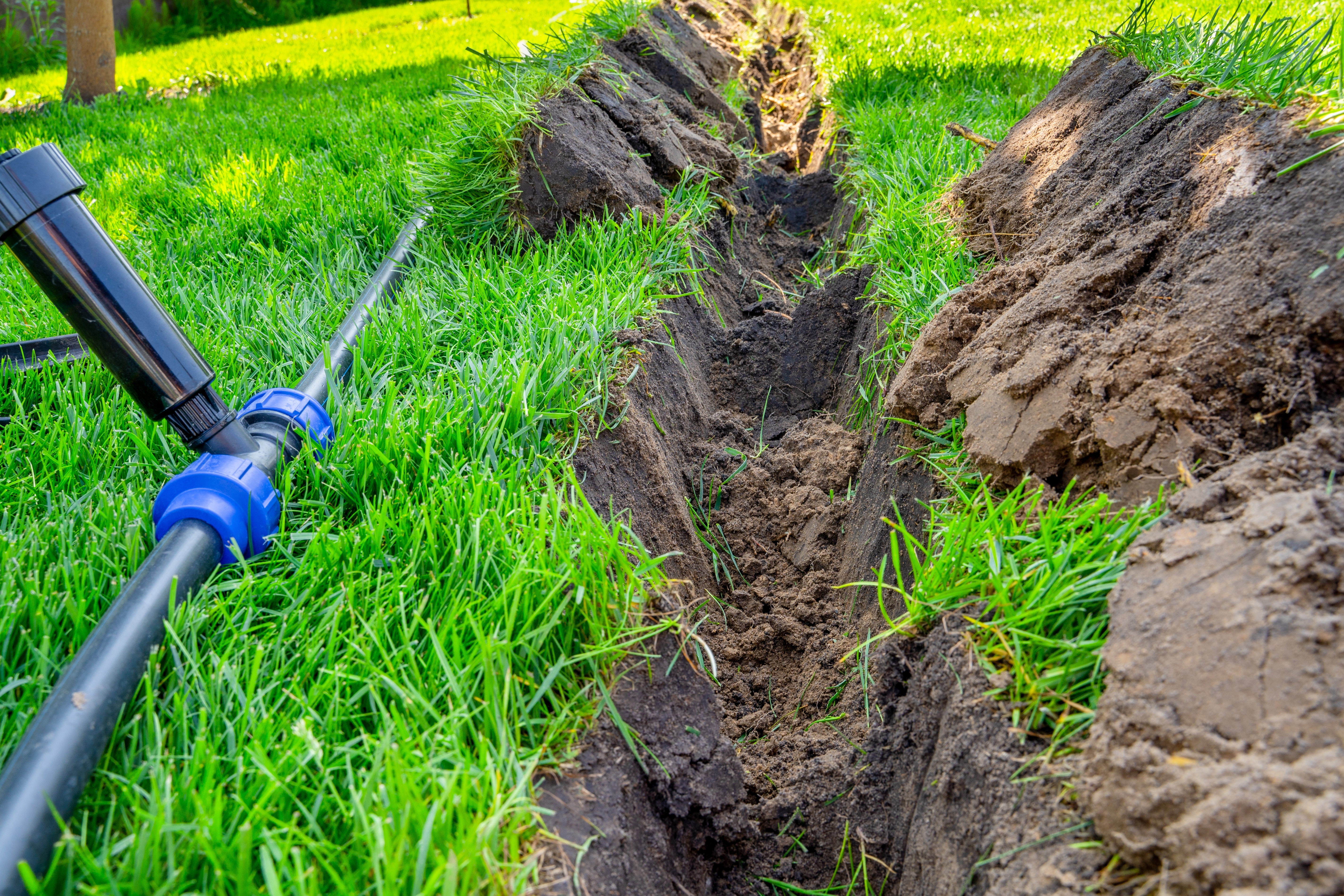 New lawn sprinkler system installed in a Mckinney TX backyard